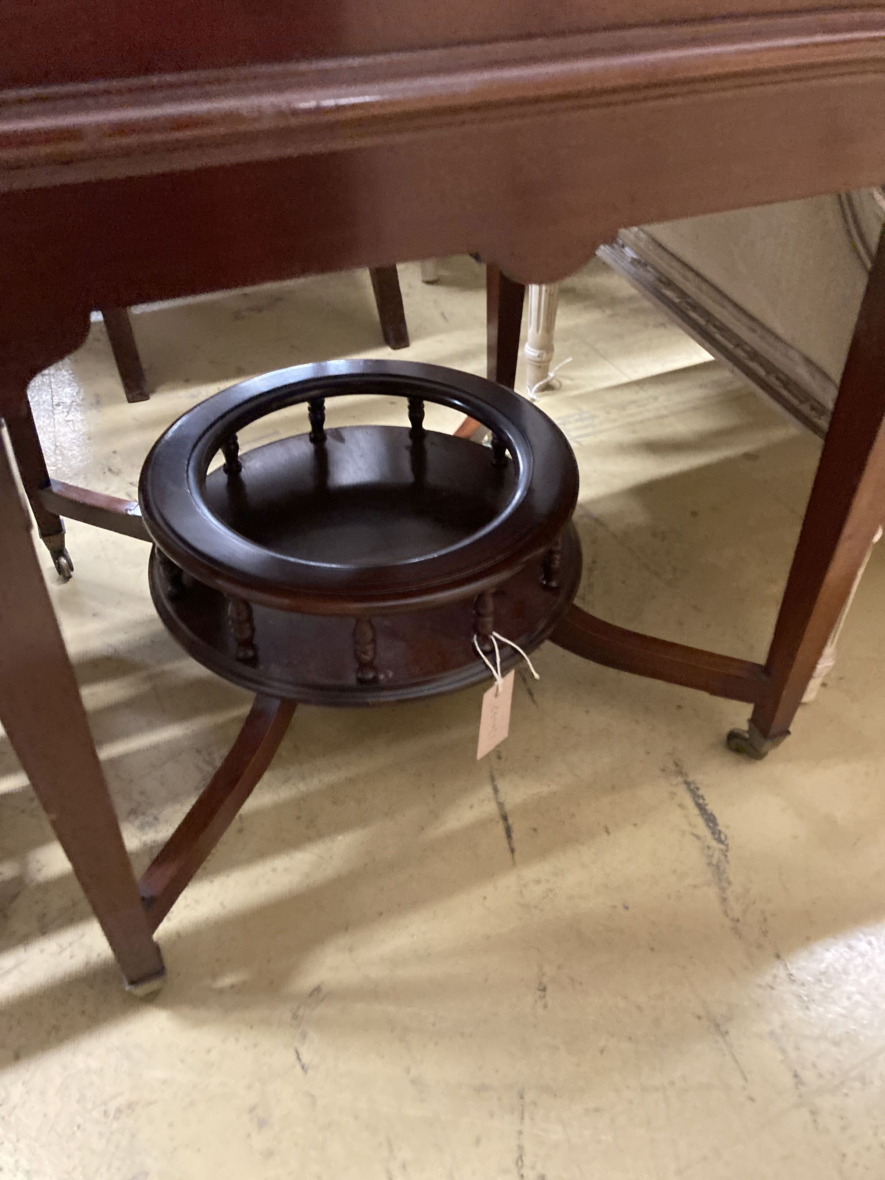 An Edwardian mahogany Surprise drinks table by Maple & Co., width 58cm, depth 60cm, height 76cm